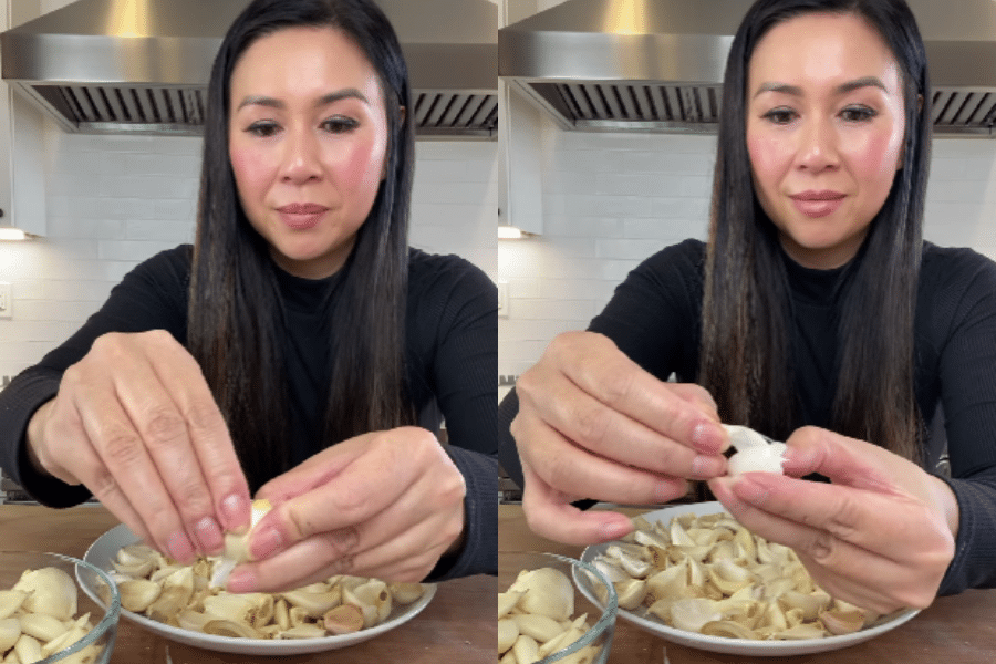 Side-by-side images of a woman in a black top demonstrating how to peel garlic cloves by hand at a kitchen counter. She sits in front of a large plate and bowl filled with garlic, removing the skins with her fingers.
