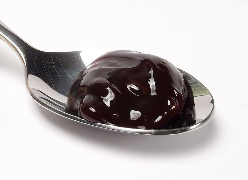 spoon full of black beet syrup