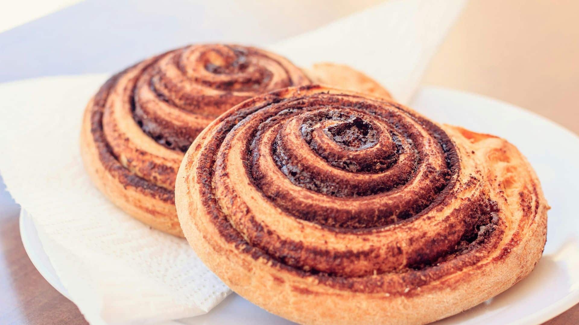 Cinnamon roll on a white plate