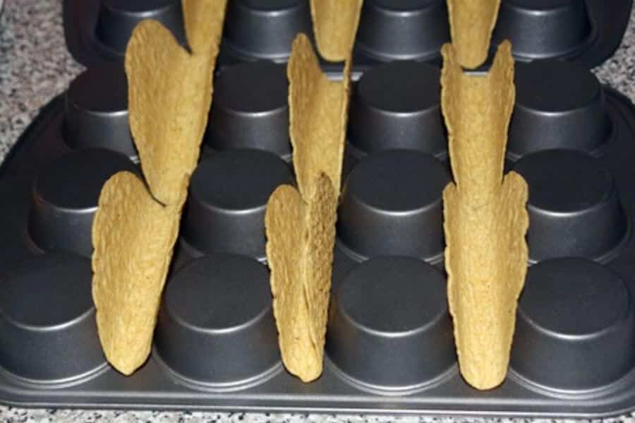 taco shells on a muffin tin