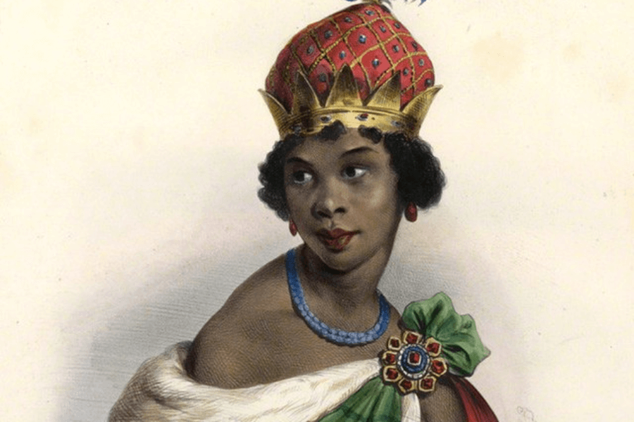 A historical portrait of a regal woman wearing an ornate red and gold crown adorned with intricate patterns and jewels. She is draped in luxurious fabric, with a blue beaded necklace and a decorative brooch pinned to a green sash. Her poised expression and slight smile give her a dignified and powerful presence.