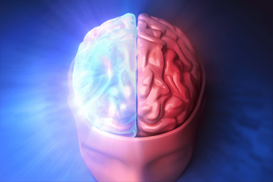 A digitally rendered image of a human brain, split into two contrasting halves—one side glowing with a blue, futuristic light, while the other appears as a traditional red brain structure. The blue side radiates energy, symbolizing technology, intelligence, or neural activity.