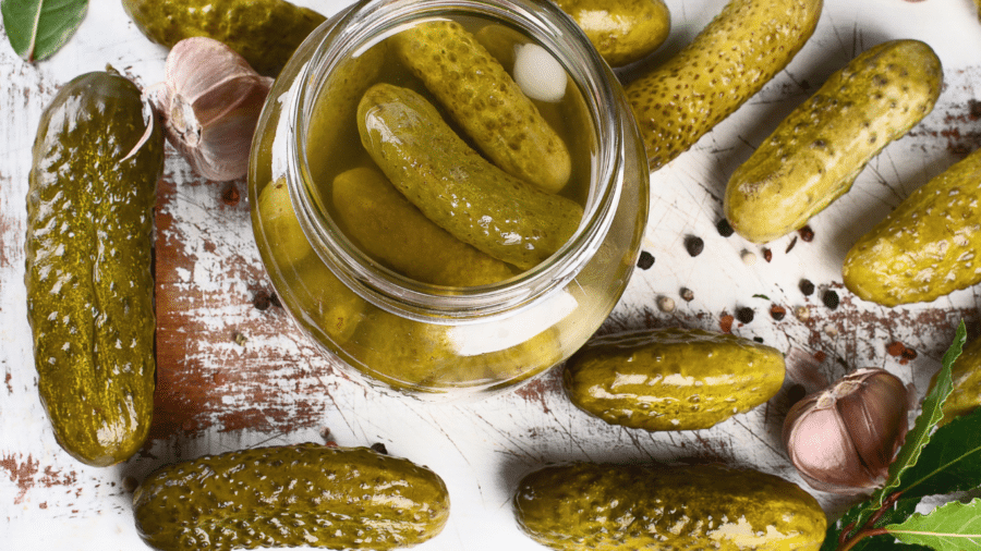 Pickles in a jar and on the table