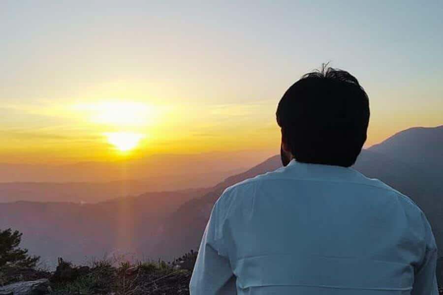 Man looking at the sunset