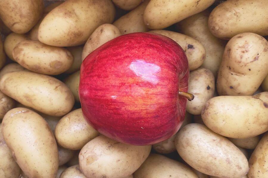Apple on top of potatoes