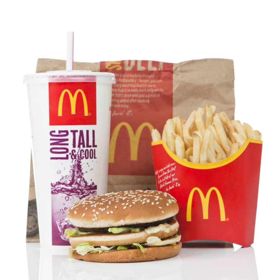 Newcastle upon Tyne, England - March 5, 2011: McDonald's Big Mac value meal isolated on a white background. A Big Mac, fries and a coke sitting on a reflective surface.