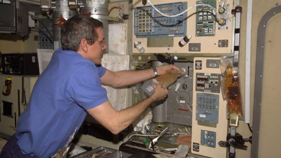 Astronaut William S. (Bill) McArthur, Expedition 12 commander and NASA space station science officer, adds potable water to a soft beverage container at the galley in Zvezda Service Module of the International Space Station.