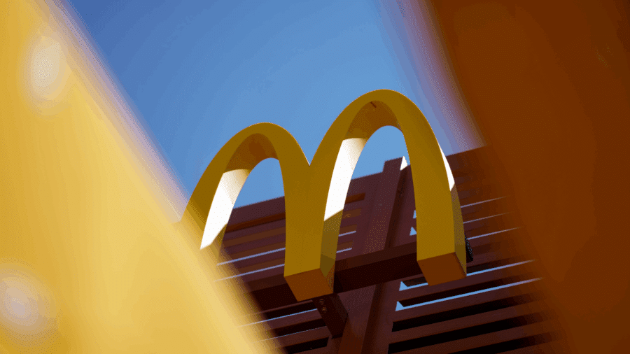 McDonald’s restaurant exterior in Alexandria, Ukraine with people walking past