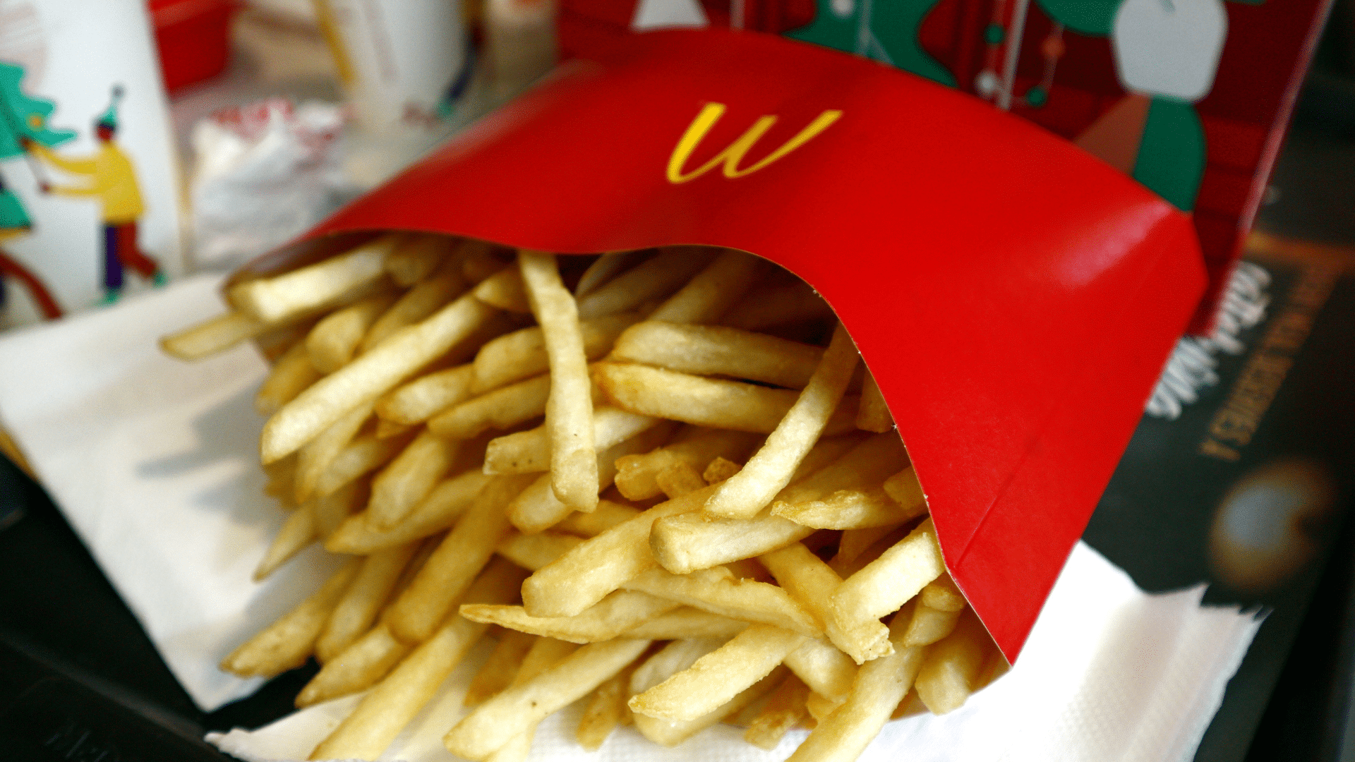 McDonald’s French fries in branded packaging on a food tray