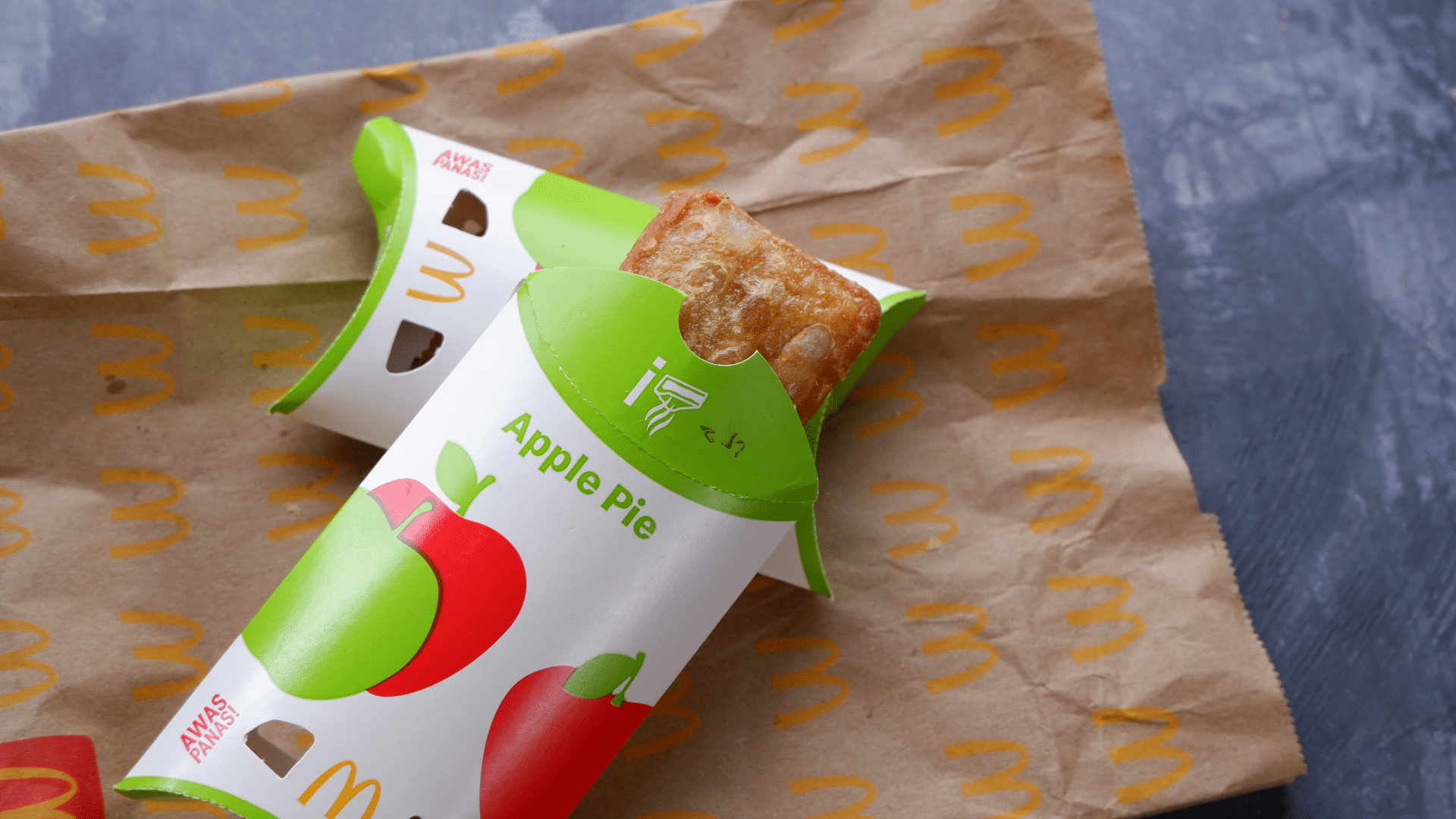 McDonald’s apple pie placed on a brown paper bag with logo