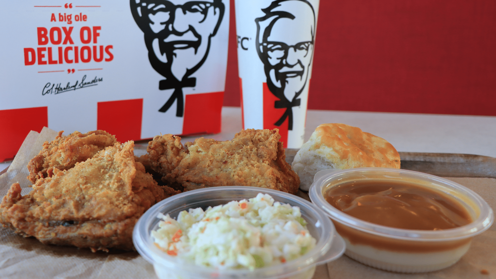 KFC box with fried chicken, mashed potatoes, and gravy cup