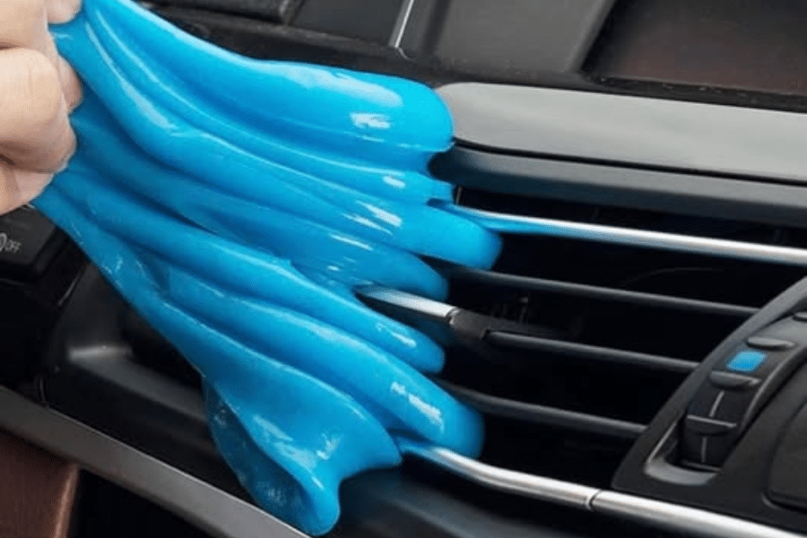blue slime cleaning car dashboard