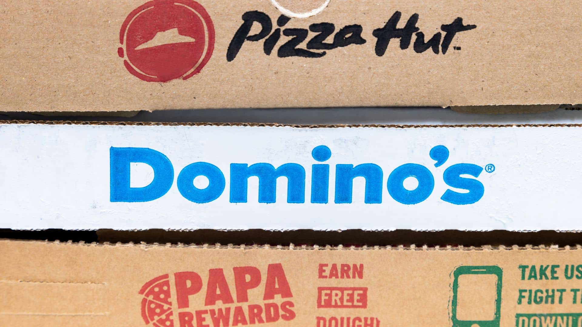 Calgary, Alberta, Canada. Jan 11, 2023. Close up to Pizza boxes. Pizza hut, Domino's, Papa John's.