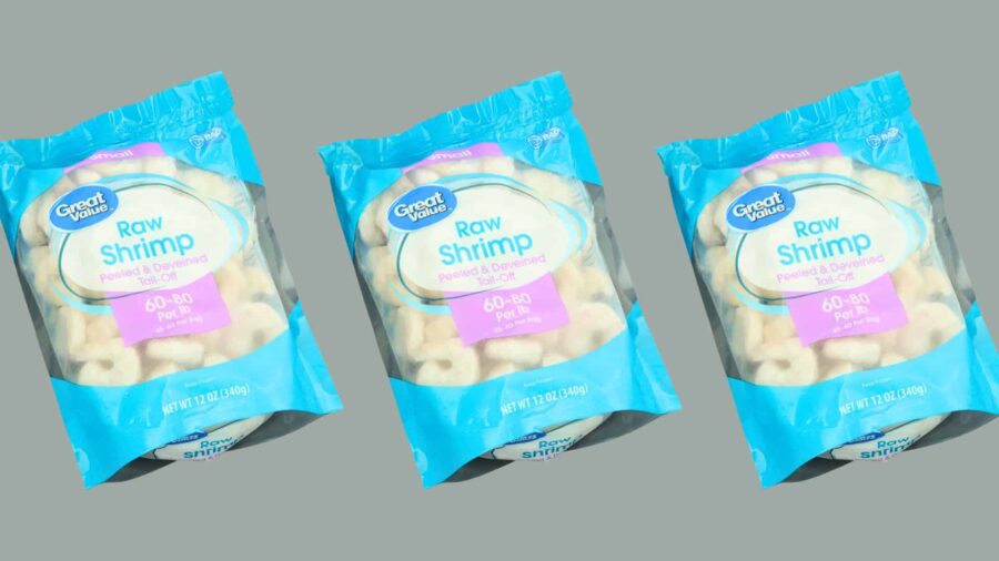 MIAMI, FLORIDA USA - 07-18-2024 One bag of Great Value brand shrimp isolated against dark background.