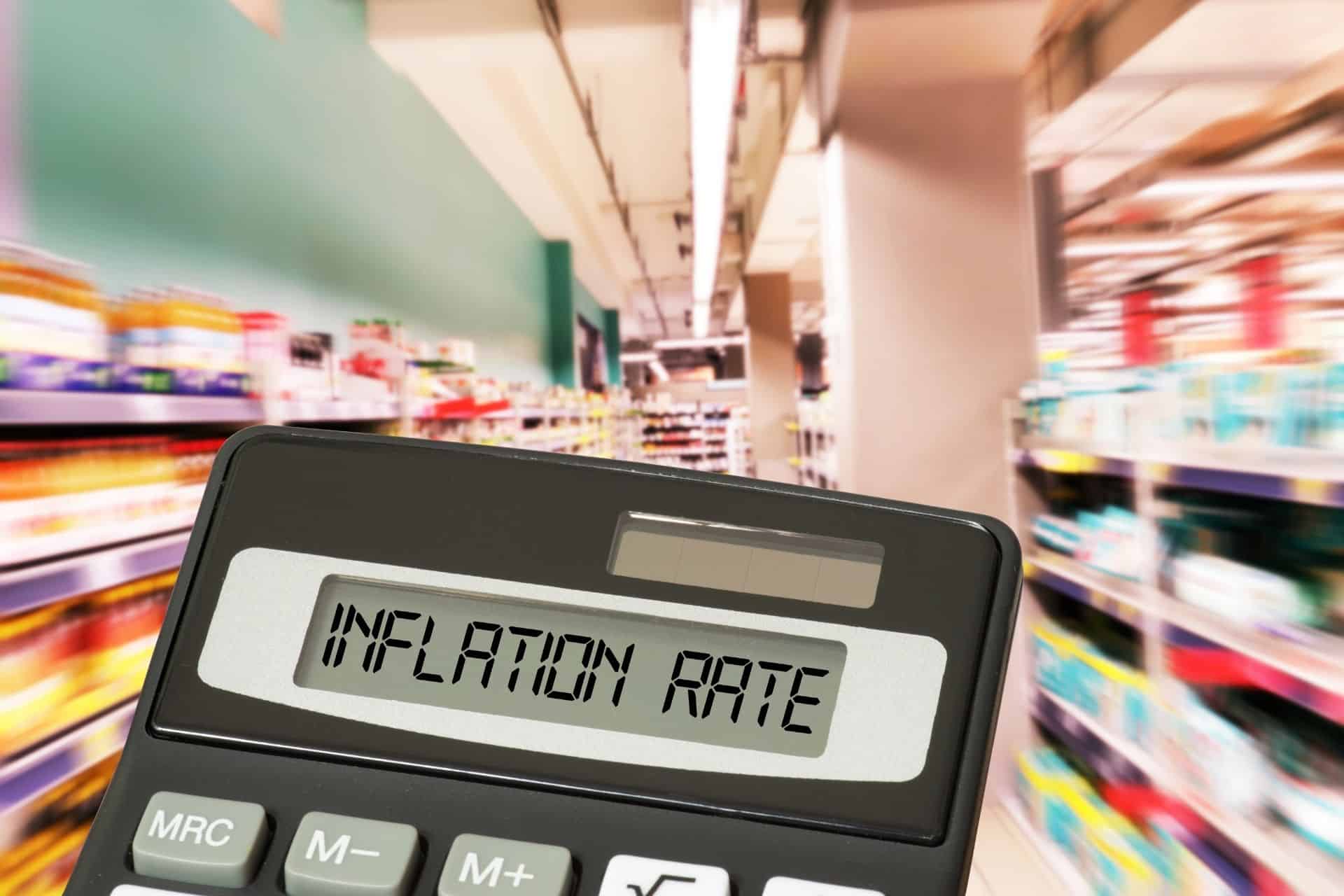 Words "inflation rate" on a calculator's screen