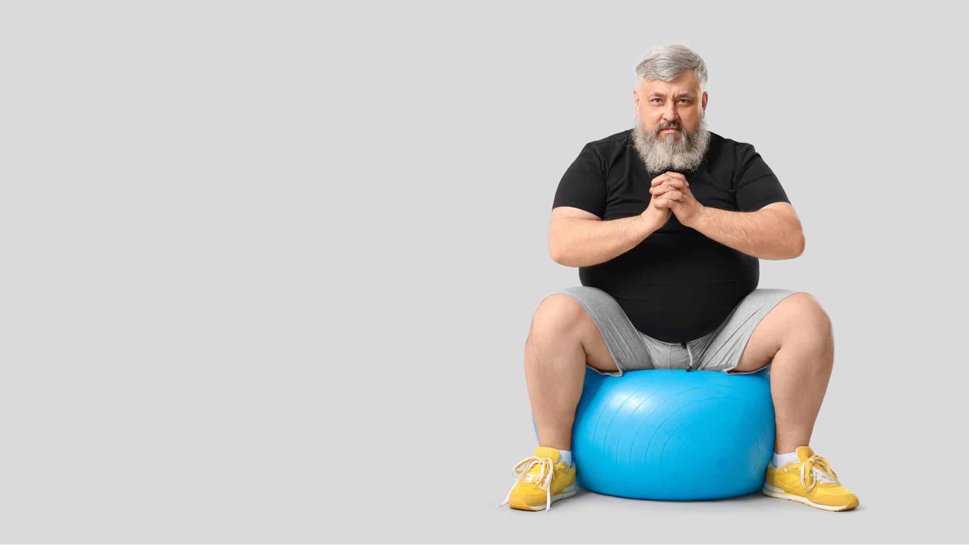 A man sitting on an exercise ball