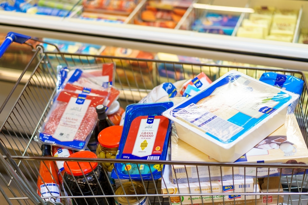 A shopping cart full of food items