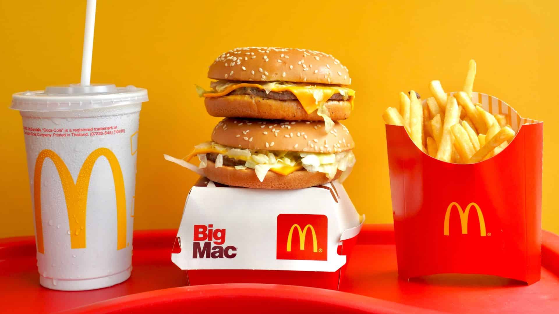 Exterior of a McDonald’s restaurant with signage and customers visible