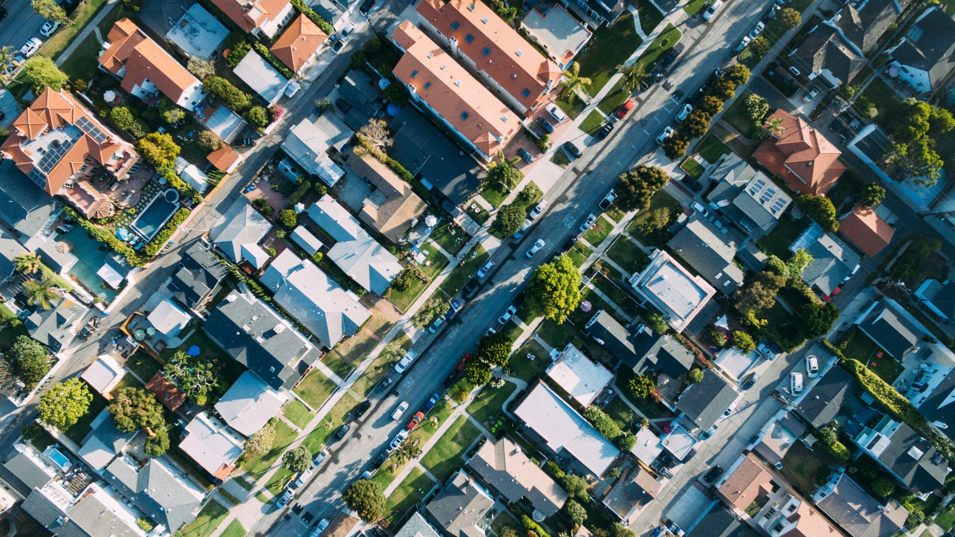 Aerial view of residential houses connected by roads