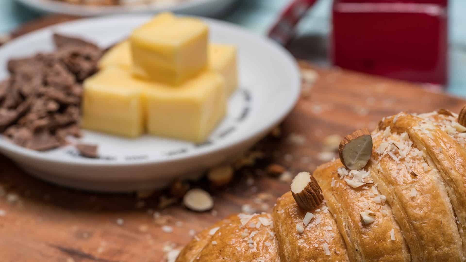 Stacked butter on a plate with additional food