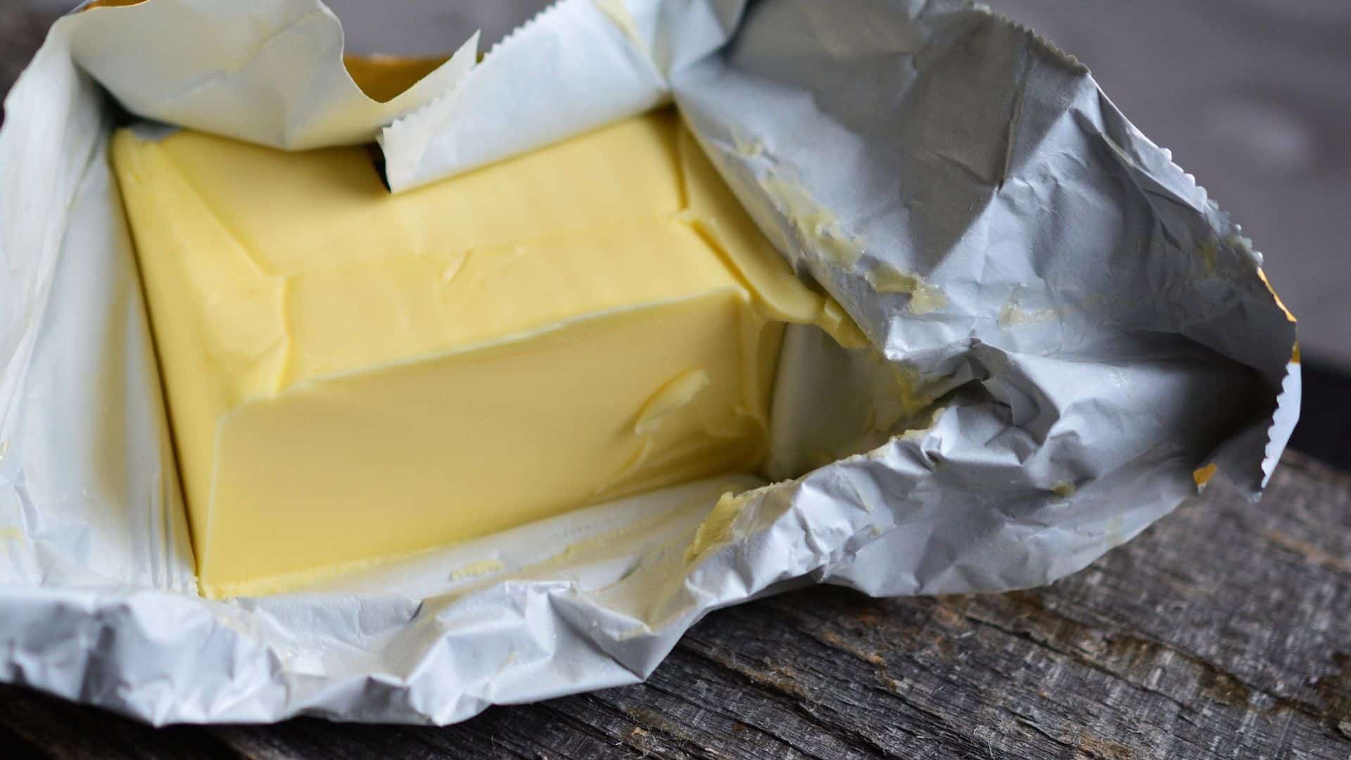 A stick of butter in silver packaging
