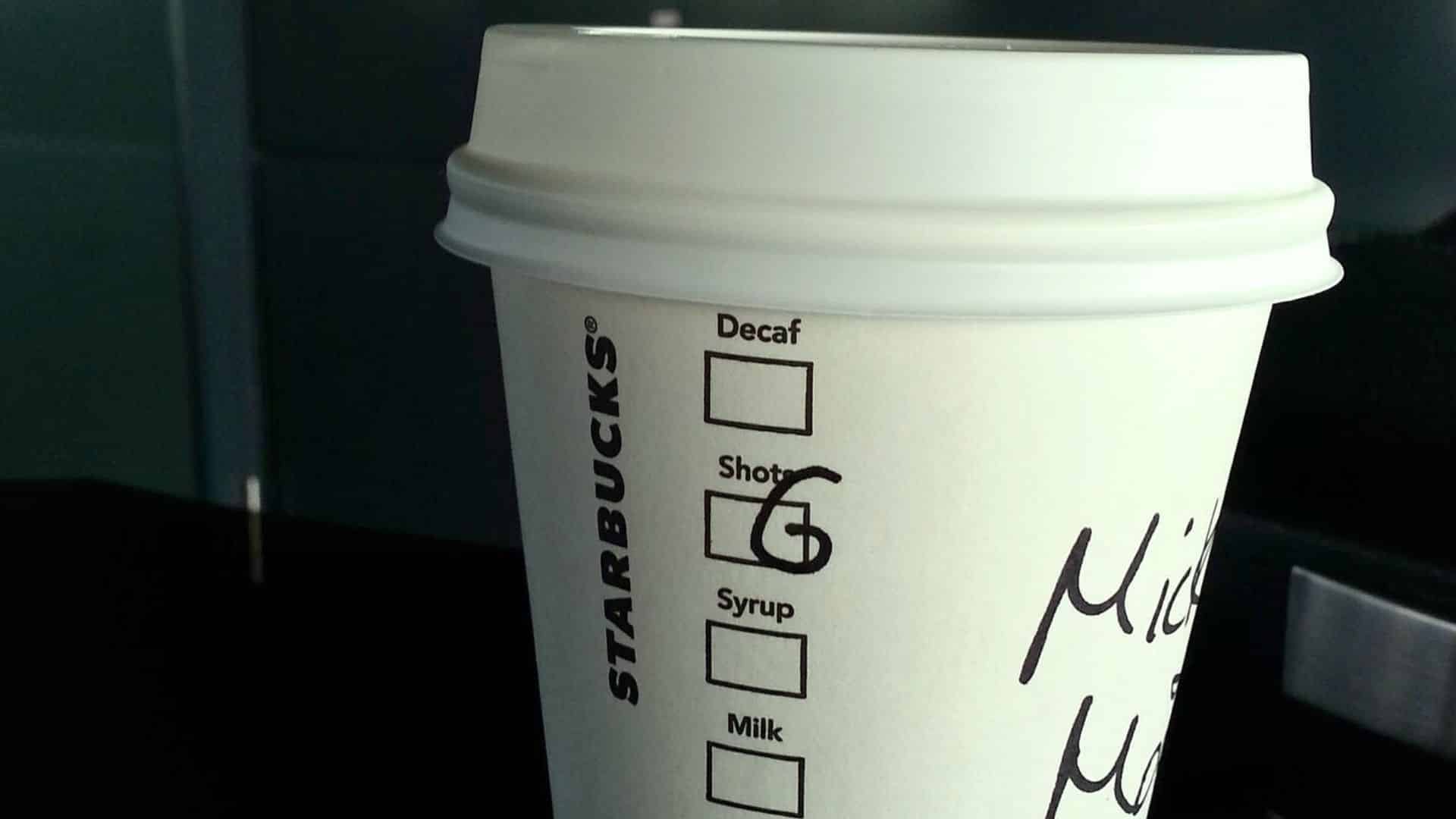 Starbucks cup with handwritten text