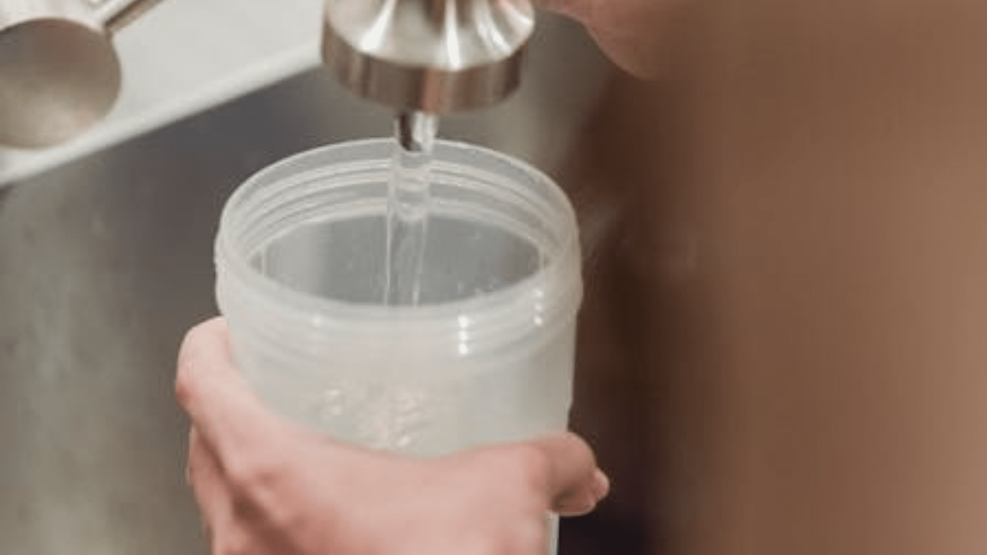 filling water bottle with water