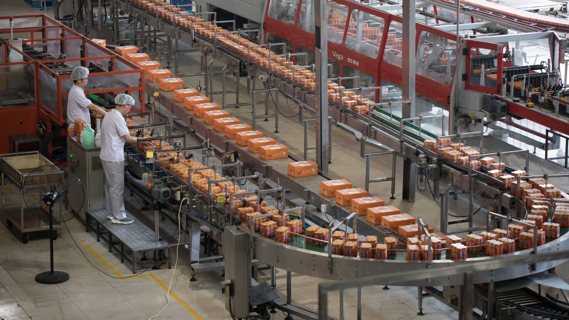 Carbonated drinks factory with view of production and bottles