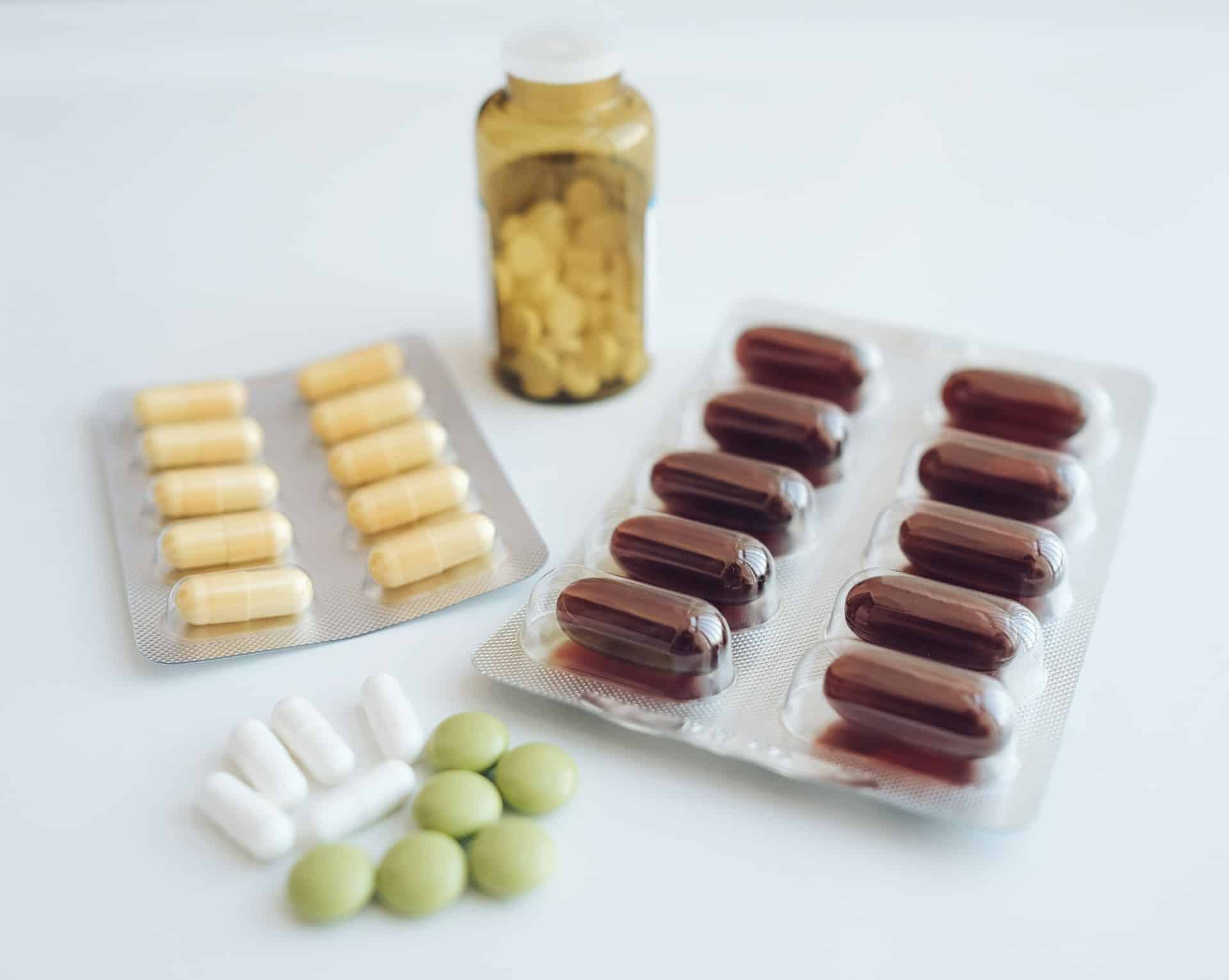 Different pills close-up on a white background