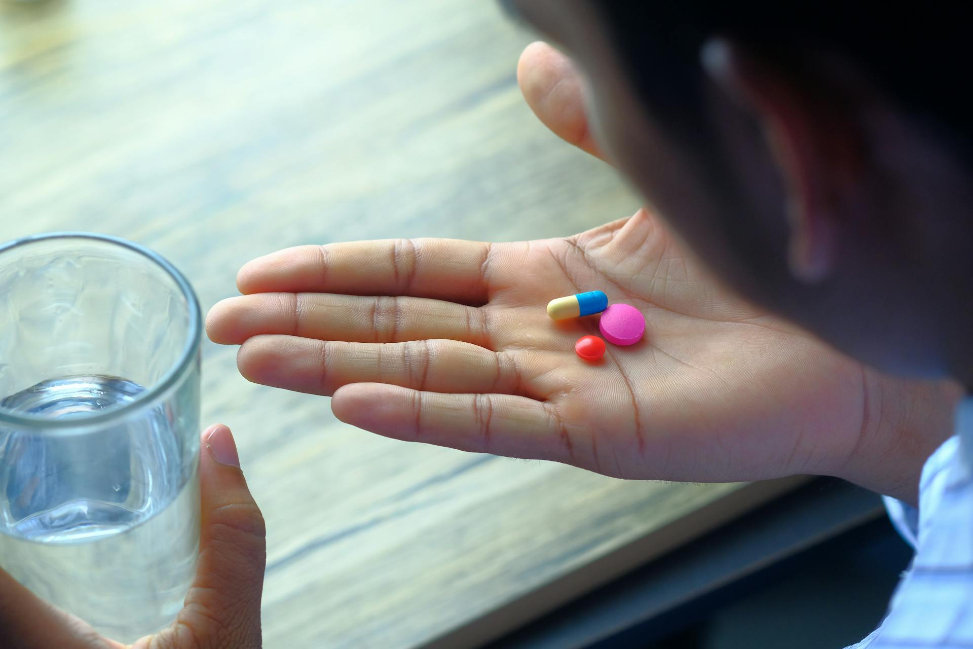 Vitamins in a person's hand
