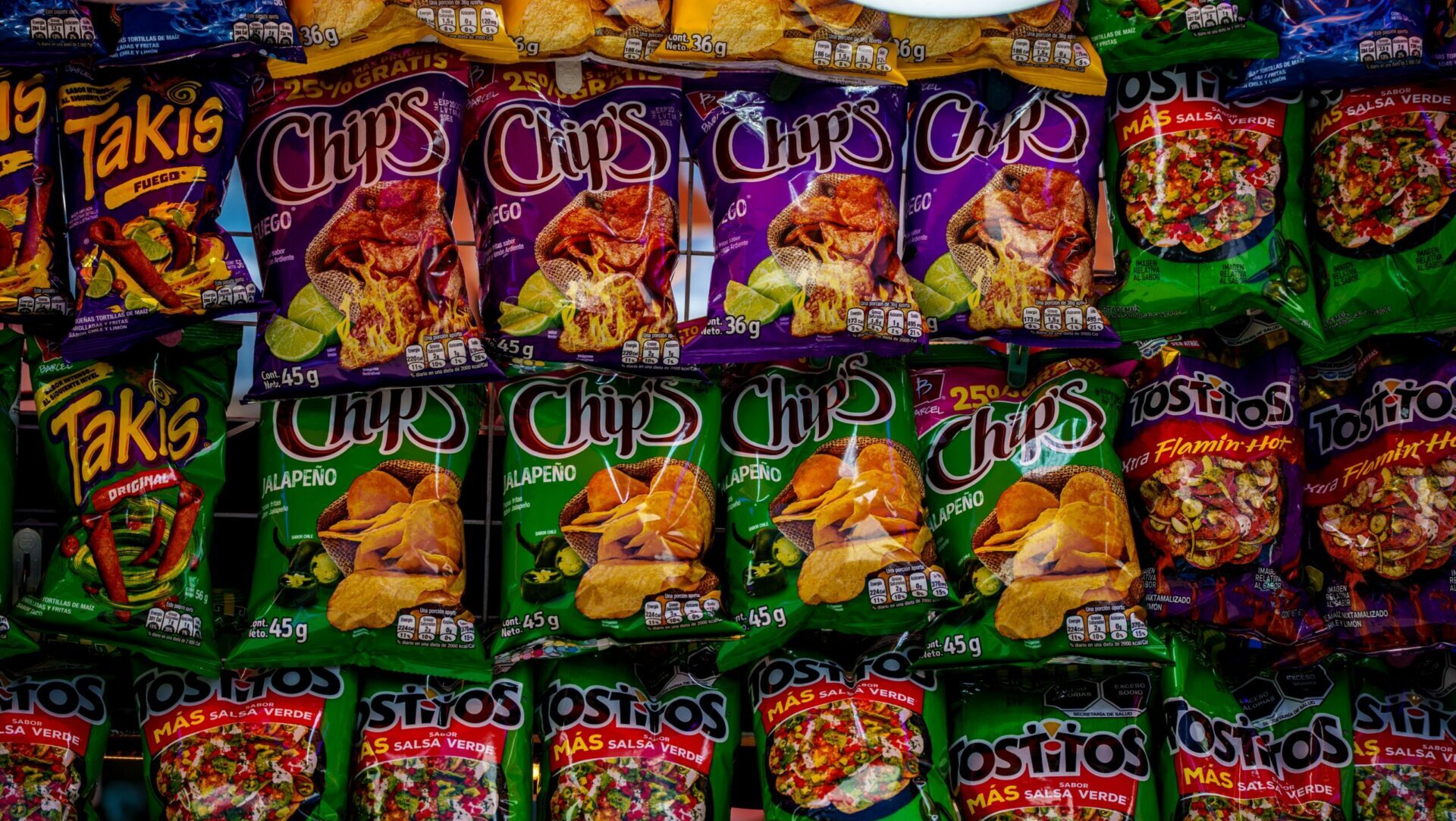 Various snack brands displayed on store shelves showing packaged food selection