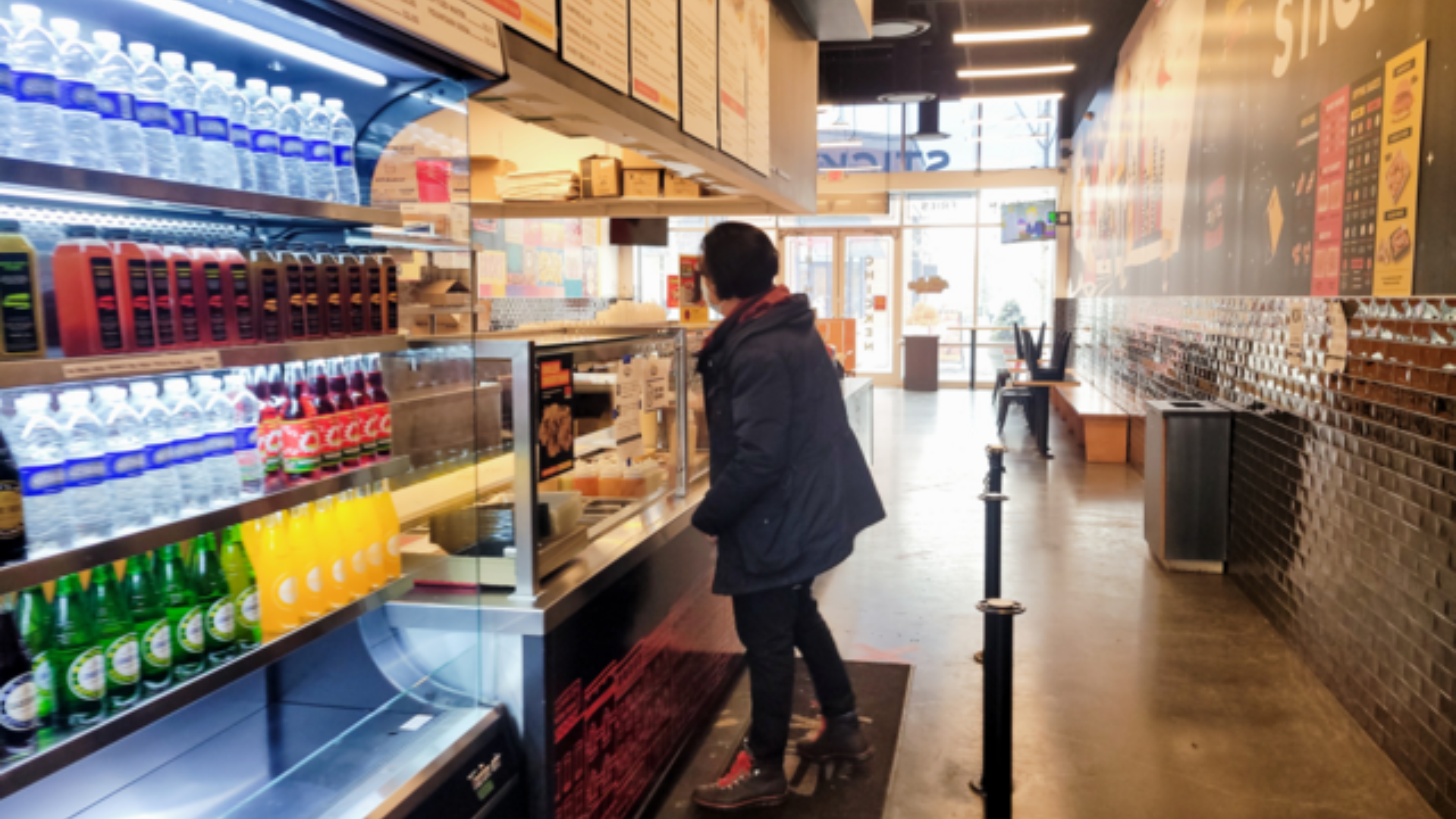 Person ordering inside Sticky Fingers