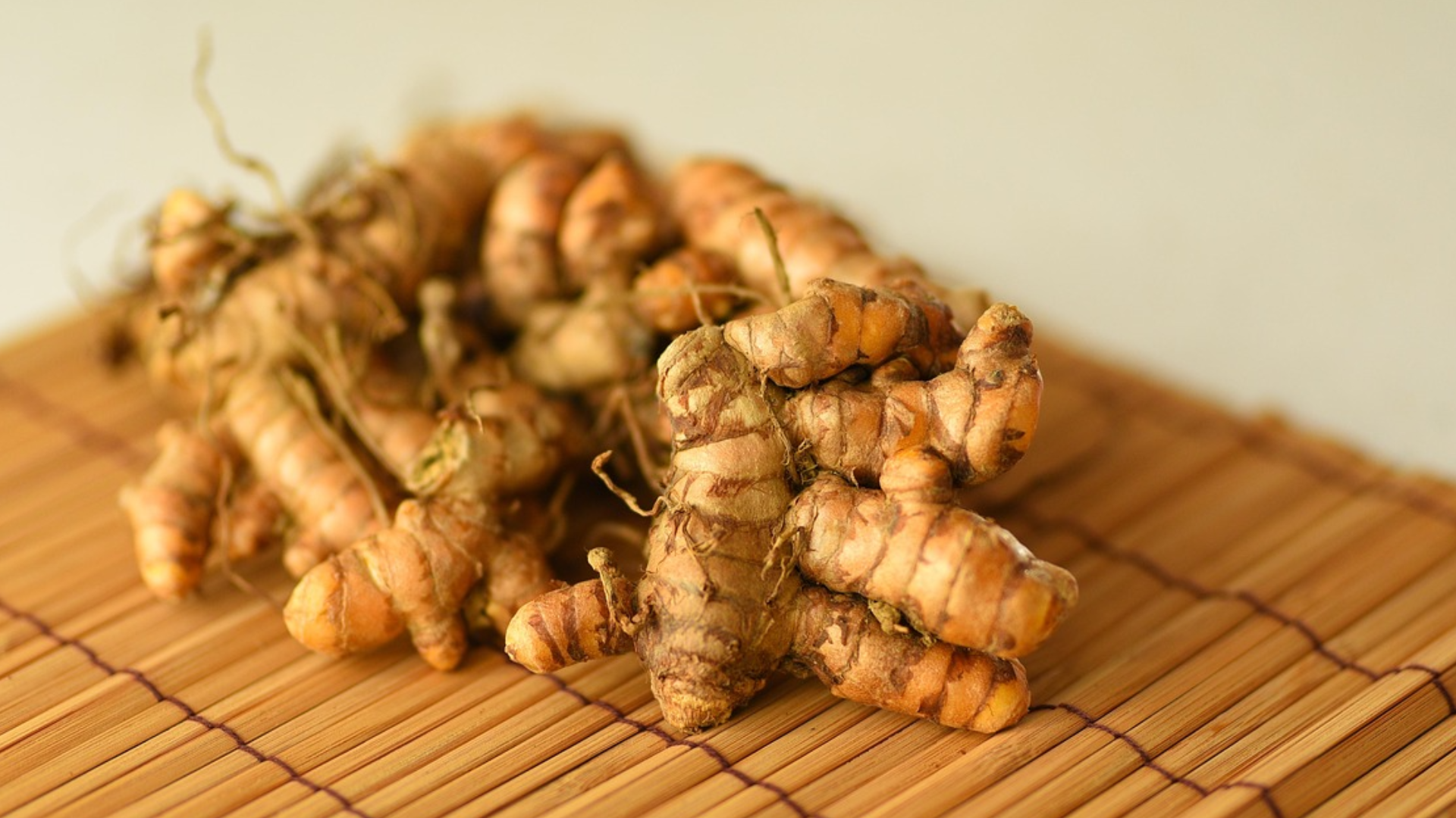 Tumeric in a wooden placemat.