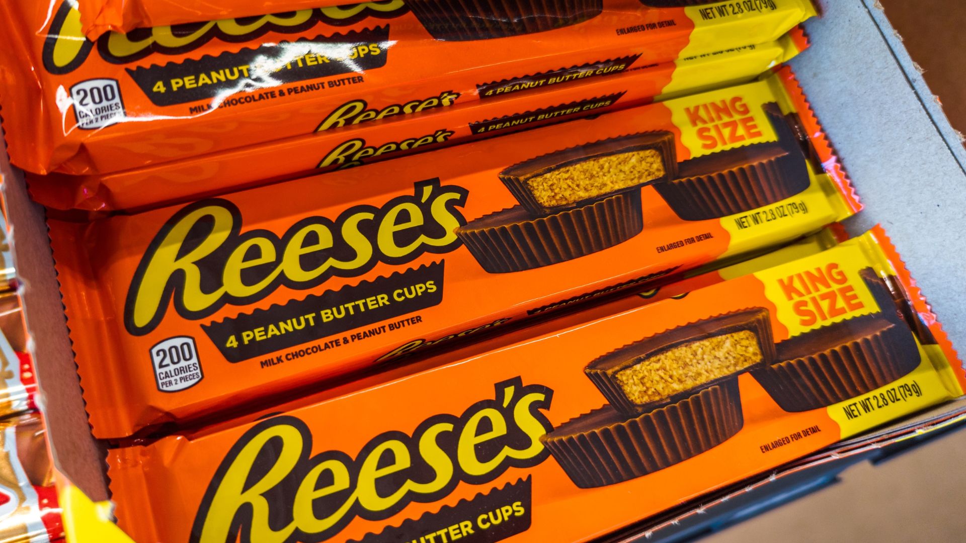 Reese's Peanut Butter Cups Candy Products on a shelf at a store.