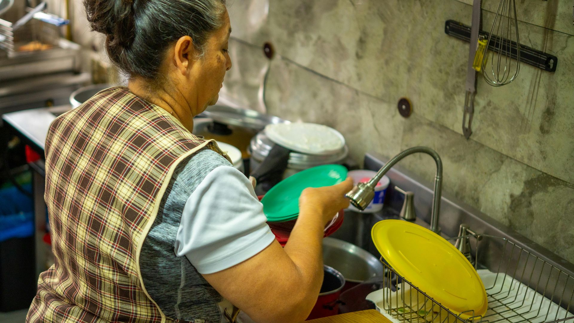 Woman washing dishes