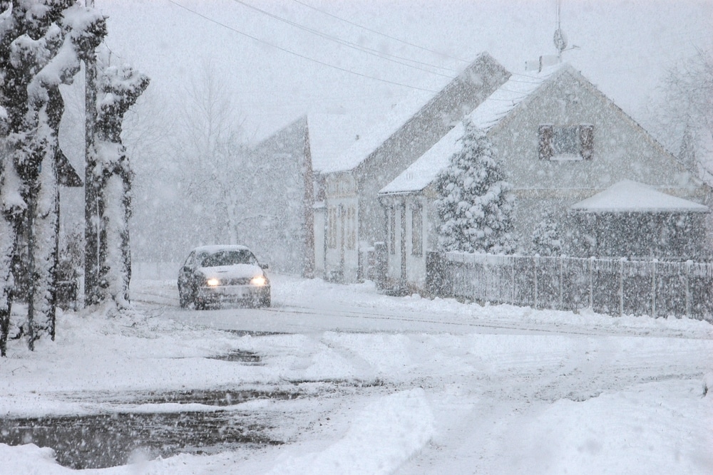Car driving through the snow storm