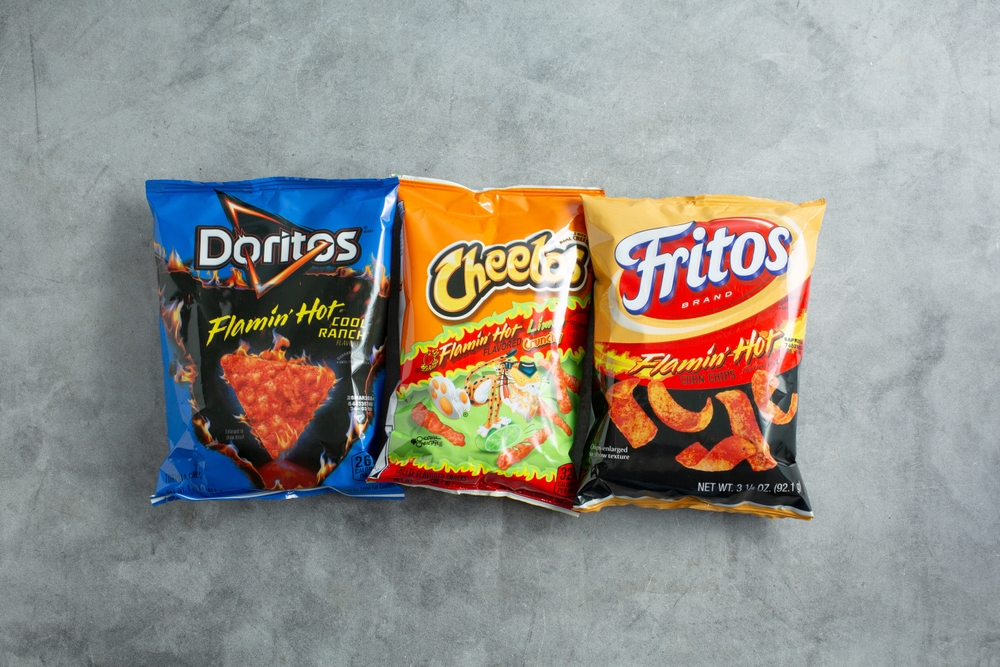 Top view of Cheetos, Doritos, and Fritos chips