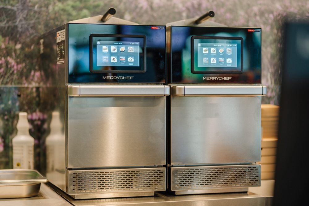 Two Merrychef commercial ovens in a fast food kitchen counter.