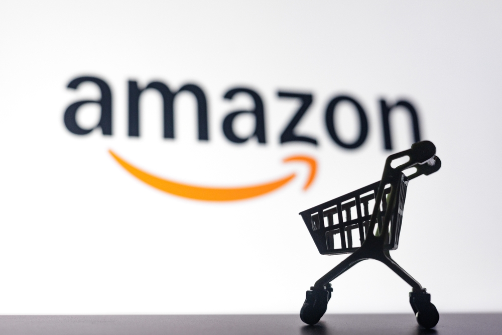 Miniature shopping cart with Amazon logo on screen