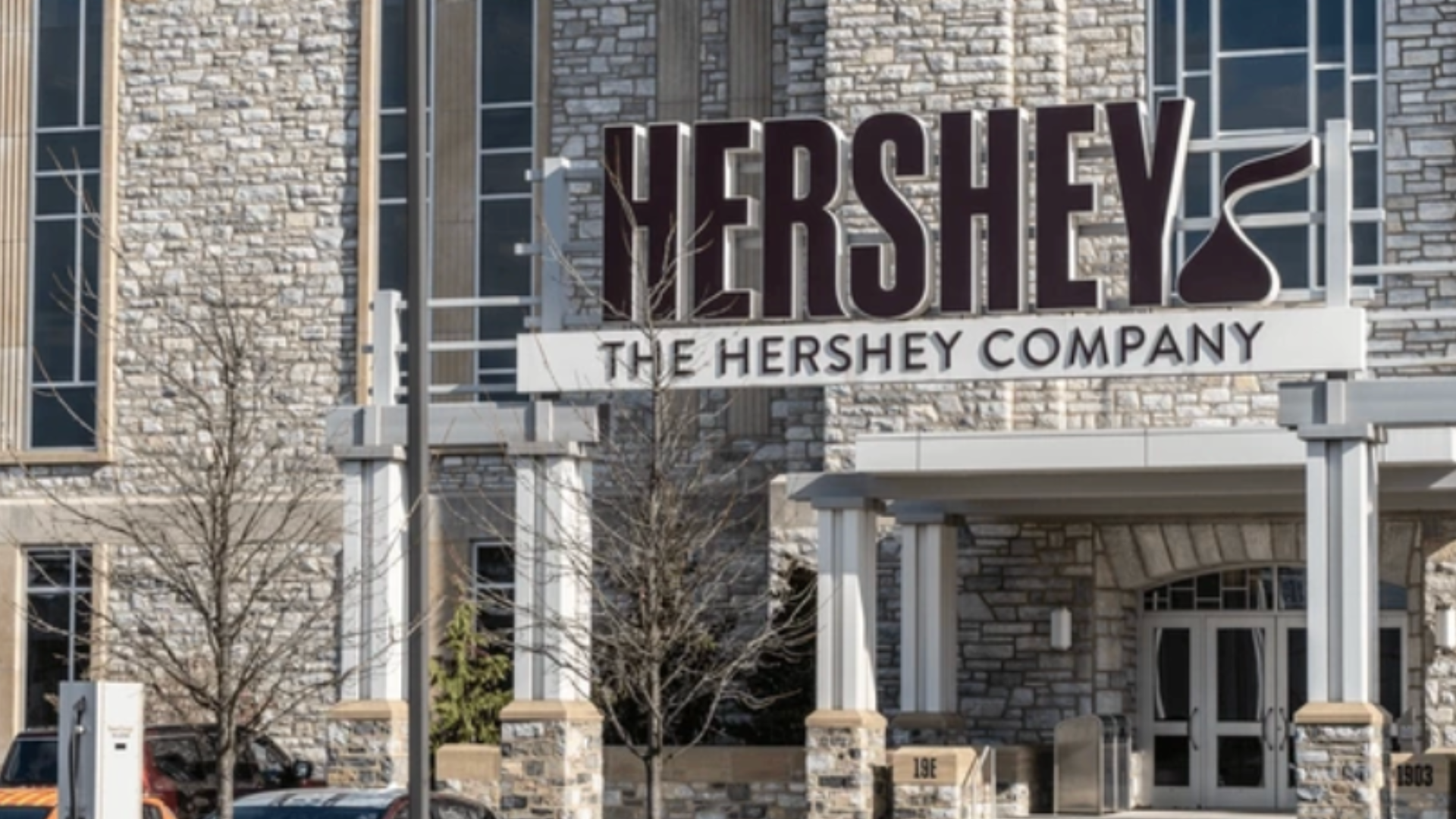 Exterior of The Hershey Company building with large Hershey sign.