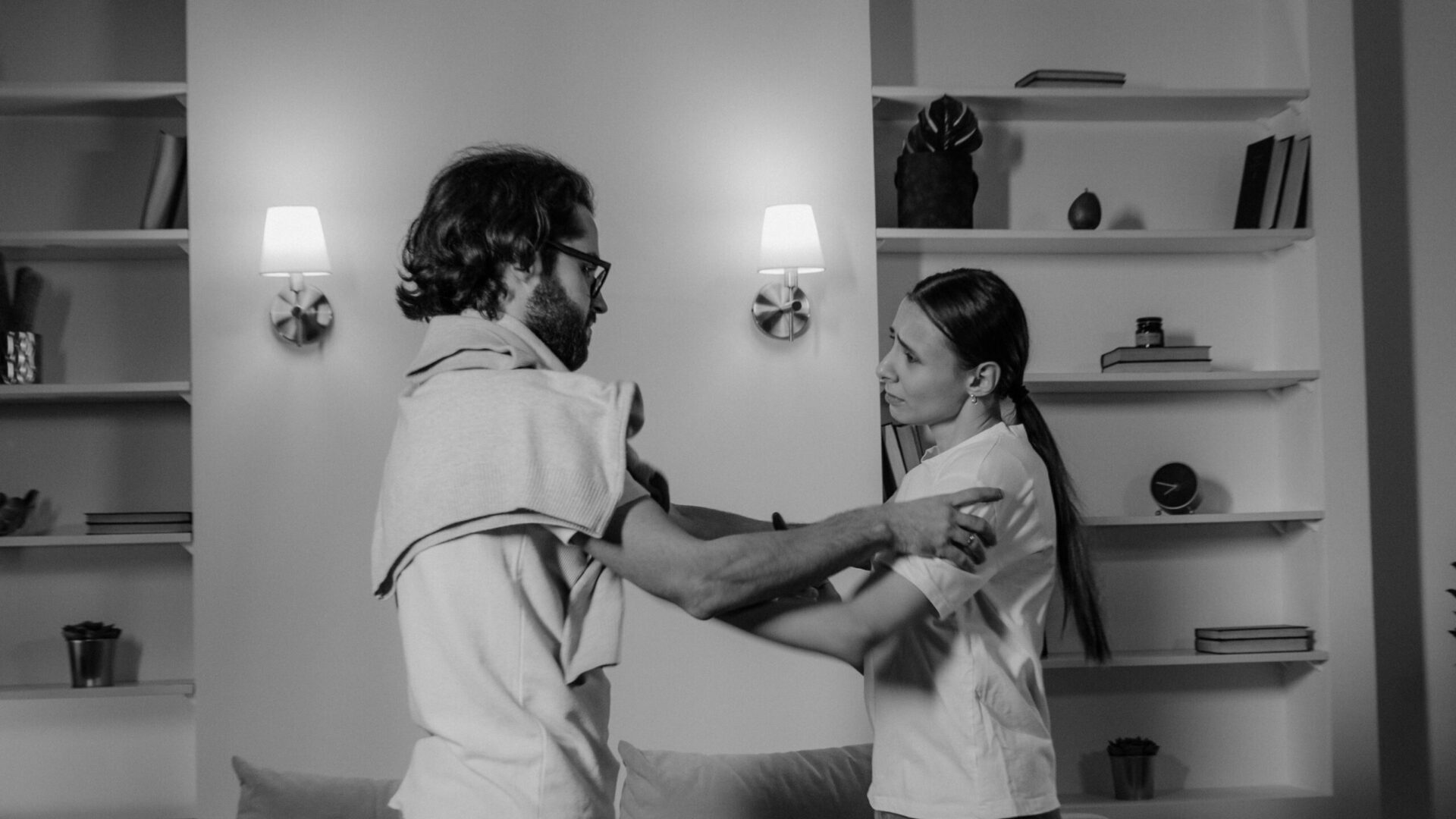 Man and woman arguing in a restaurant during a tense interaction.