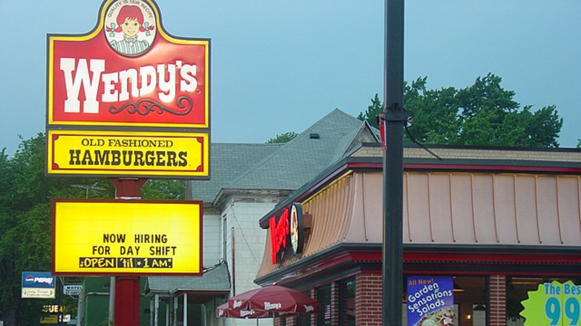 Wendy’s restaurant sign outside a fast food location.