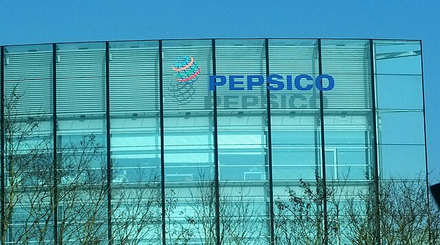 PepsiCo logo on glass office building facade.