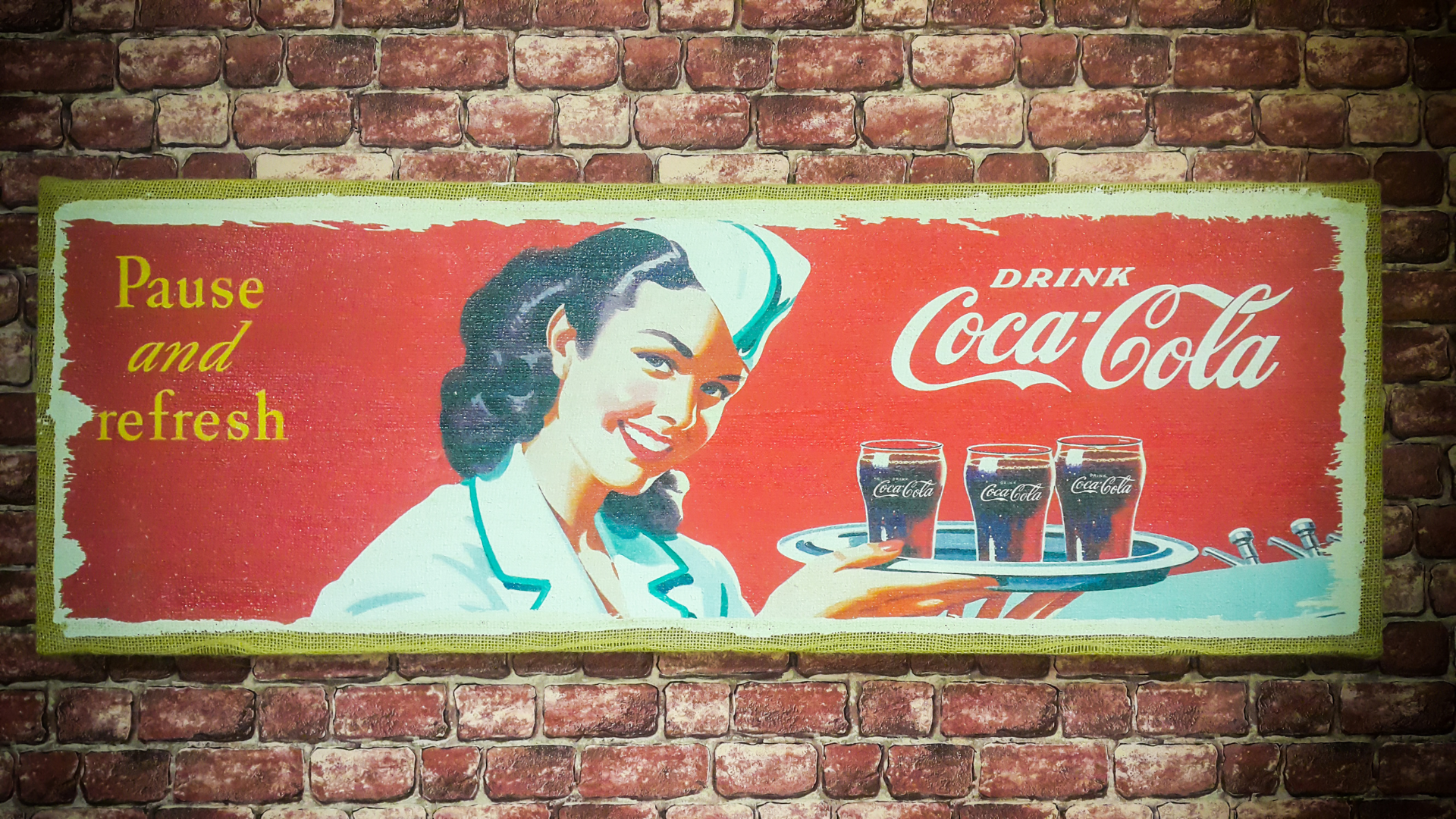Old condition vintage wall of Coca-Cola advertisement.