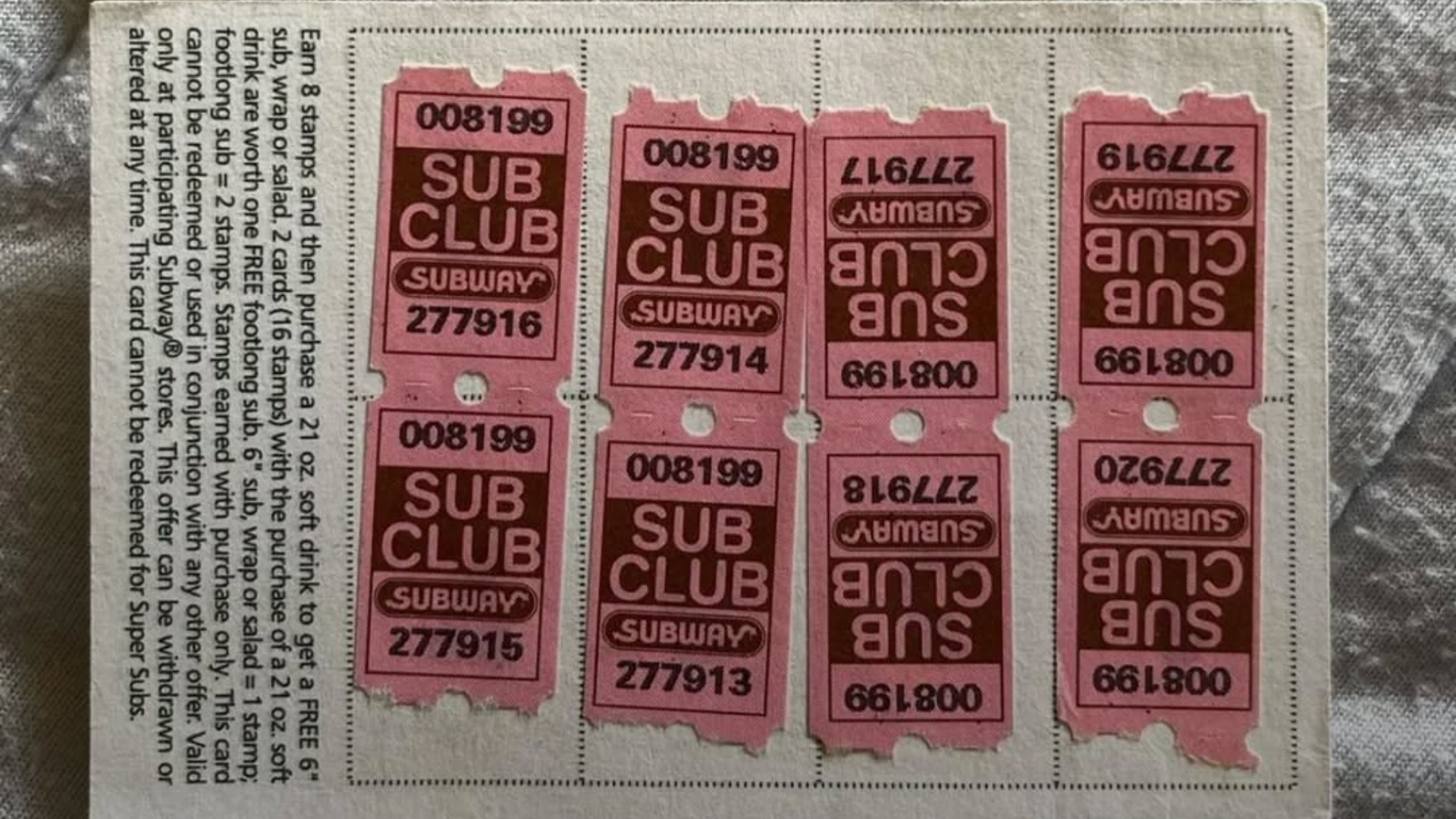 Subway "Sub Club" reward card showing pink stamps and promotional rules for earning free sandwiches.