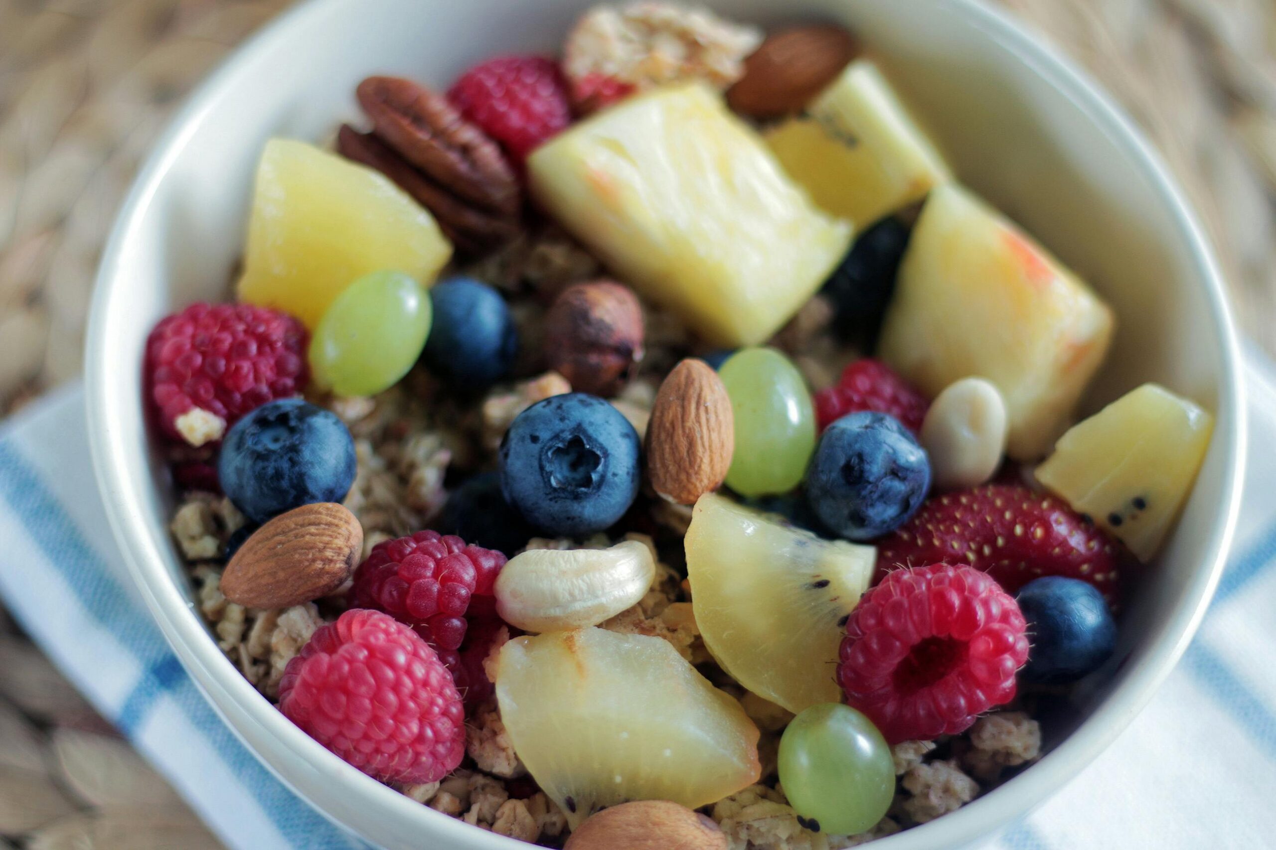 Granola bowl with mixed fruit and nuts.