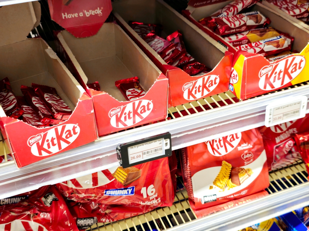 KitKat chocolate bars displayed on a retail store shelf.