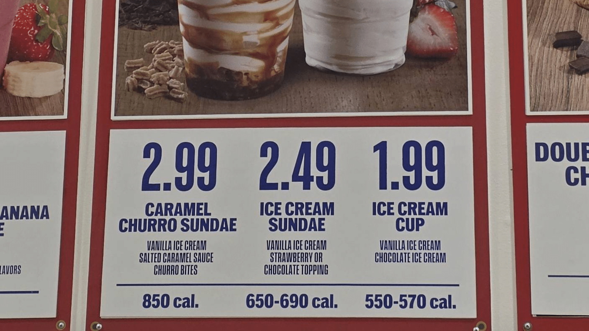 A close-up of a portion of the Costco Food Court menu board showing the dessert section: the Caramel Churro Sundae is listed at $2.99 and contains 850 calories, followed by standard sundaes and ice cream cups.