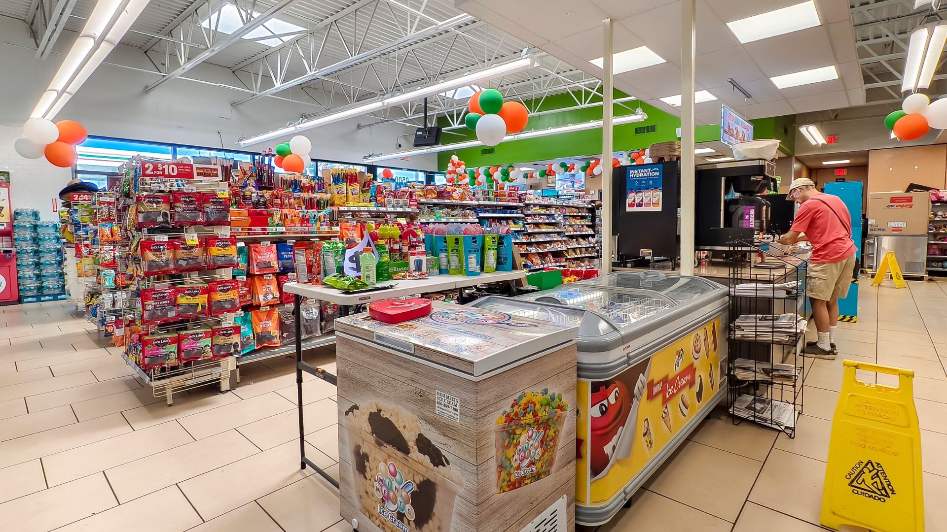 Inside a 7-Eleven convenience store showcasing organized shelves filled with various products.