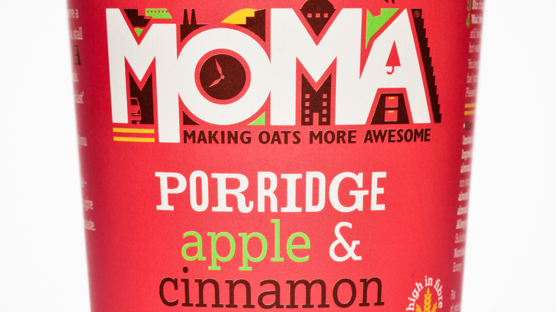 A red _MOMA_ brand instant porridge pot, apple and cinnamon flavored, labeled dairy-free and gluten-free.